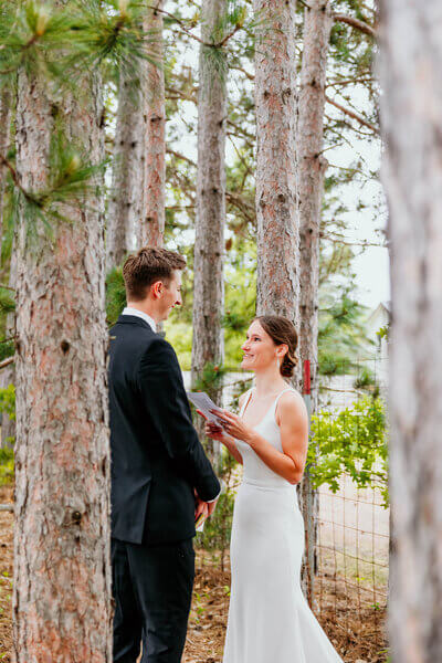 Bride and groom private vow ceremony outdoors in the woods