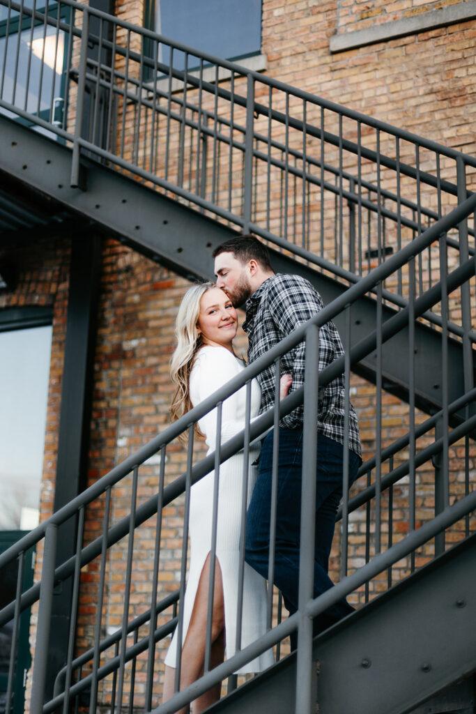 Engagement photos on fire escape stairs