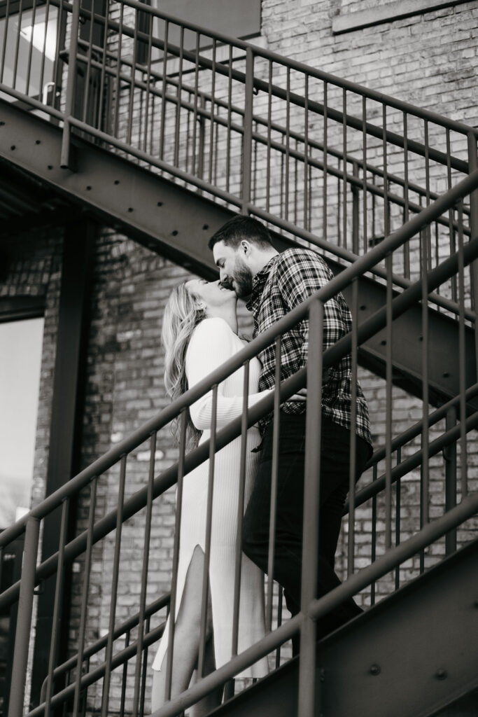 Industrial city engagement photos on stairs
